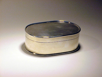 A silver little oval case