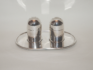 A silver salt and black pepper tray 
